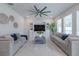 Living room with sectional sofa and built in shelving at 28818 Orange Berry Dr, Wesley Chapel, FL 33543