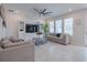 Spacious living room with comfortable seating and large TV at 28818 Orange Berry Dr, Wesley Chapel, FL 33543