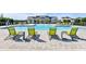 Community pool with green lounge chairs at 28818 Orange Berry Dr, Wesley Chapel, FL 33543