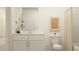 Modern bathroom with white cabinets and a neutral color scheme at 32202 Jamaica Caper Way, San Antonio, FL 33576