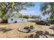 Backyard with fire pit and parking area at 3612 Phillips St, Tampa, FL 33619