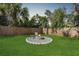Relaxing backyard with fire pit and wood fence at 3612 Phillips St, Tampa, FL 33619