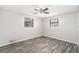 Charming bedroom with wood-look floors and two windows at 3612 Phillips St, Tampa, FL 33619