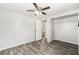 Bedroom with wood-like floors and double door closet at 3612 Phillips St, Tampa, FL 33619