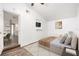 Bright bedroom with wood-look floors and a view into the kitchen at 3612 Phillips St, Tampa, FL 33619
