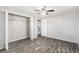 Spacious bedroom with wood-look floors and mirrored closet doors at 3612 Phillips St, Tampa, FL 33619