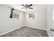 Bedroom with wood-look floors and ceiling fan at 3612 Phillips St, Tampa, FL 33619