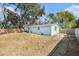 Back of house with light blue exterior and wood fence at 3612 Phillips St, Tampa, FL 33619