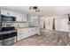 Modern kitchen with white cabinets and stainless steel appliances at 3612 Phillips St, Tampa, FL 33619