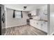 Modern kitchen with white cabinets, butcher block countertops, and stainless steel appliances at 3612 Phillips St, Tampa, FL 33619
