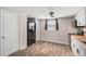 Modern kitchen with white cabinets, butcher block countertops, and stainless steel appliances at 3612 Phillips St, Tampa, FL 33619
