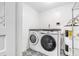 Laundry room with washer, dryer, and stylish patterned flooring at 3612 Phillips St, Tampa, FL 33619