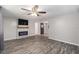 Spacious living room with hardwood floors and a fireplace at 3612 Phillips St, Tampa, FL 33619