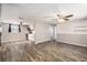 Spacious living area featuring hardwood floors and a ceiling fan at 3612 Phillips St, Tampa, FL 33619