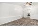 Bright spare bedroom with wood-look floors and access to laundry at 3612 Phillips St, Tampa, FL 33619