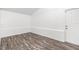 Empty spare bedroom with wood-look floors and white walls at 3612 Phillips St, Tampa, FL 33619