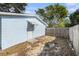 Light blue storage shed and wooden fence at 3612 Phillips St, Tampa, FL 33619