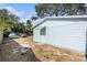 Light blue storage shed with a wooden gate at 3612 Phillips St, Tampa, FL 33619
