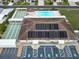 Community clubhouse with solar panels, pool, and shuffleboard courts at 37622 New Horizons Blvd, Zephyrhills, FL 33541