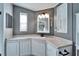 Corner sink and vanity with a mirror at 37622 New Horizons Blvd, Zephyrhills, FL 33541