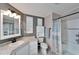 Bathroom with corner sink, toilet and shower/tub combo at 37622 New Horizons Blvd, Zephyrhills, FL 33541