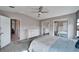 Bright bedroom with ceiling fan, large closet and dresser at 37622 New Horizons Blvd, Zephyrhills, FL 33541