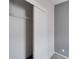 Bedroom closet with sliding doors and wire shelving at 37622 New Horizons Blvd, Zephyrhills, FL 33541