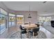 Bright dining area with bay window and round table, overlooking the outdoors at 37622 New Horizons Blvd, Zephyrhills, FL 33541