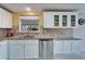 White cabinets, granite countertops, and stainless steel appliances at 37622 New Horizons Blvd, Zephyrhills, FL 33541