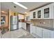 Modern kitchen with stainless steel appliances and granite countertops at 37622 New Horizons Blvd, Zephyrhills, FL 33541