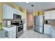 Updated kitchen with stainless steel appliances and granite countertops at 37622 New Horizons Blvd, Zephyrhills, FL 33541