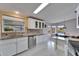 Open concept kitchen with island and stainless steel appliances at 37622 New Horizons Blvd, Zephyrhills, FL 33541