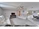 Spacious living room with vaulted ceilings,recessed lighting, and neutral color palette at 37622 New Horizons Blvd, Zephyrhills, FL 33541