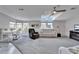 Spacious living room with comfortable seating and a workspace at 37622 New Horizons Blvd, Zephyrhills, FL 33541