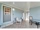 Covered patio with tile flooring and seating area at 37622 New Horizons Blvd, Zephyrhills, FL 33541