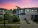 Two-story townhome with attached garage, showcasing attractive exterior at 3818 Cat Mint St, Tampa, FL 33619