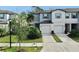 Two-story townhome with attached garage and landscaping at 3818 Cat Mint St, Tampa, FL 33619