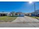 Single-story home with a carport and well-maintained front yard at 4024 Centavo Ct, Hernando Beach, FL 34607