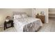 Comfortable bedroom with a floral patterned bedspread and neutral accents at 4725 Christa Ct # 331, Tampa, FL 33614