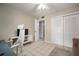 Inviting bedroom showcases tile floors, ceiling fan, closet, and well-lit doorway at 4725 Christa Ct # 331, Tampa, FL 33614