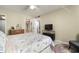 Bedroom featuring wood dresser, open closet and TV console at 4725 Christa Ct # 331, Tampa, FL 33614