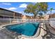 Inviting community pool area with ample seating, surrounded by lush greenery and trees at 4725 Christa Ct # 331, Tampa, FL 33614