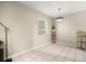 Bright dining area with tile flooring, modern light fixture and backyard views at 4725 Christa Ct # 331, Tampa, FL 33614