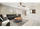 Bright living room with comfortable seating, tile floors, and views to the kitchen at 4725 Christa Ct # 331, Tampa, FL 33614
