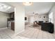 Open floor plan showcasing kitchen and living areas, complete with tile flooring and modern furnishings at 4725 Christa Ct # 331, Tampa, FL 33614