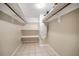 Spacious walk-in closet offering ample storage with shelves and rod for hanging clothes at 4725 Christa Ct # 331, Tampa, FL 33614