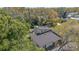 Aerial view of a modern home with a gray roof and landscaped yard at 513 Hand Ave, Sarasota, FL 34232