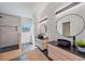 Bathroom with a walk-in shower, floating double vanity, and modern lighting at 513 Hand Ave, Sarasota, FL 34232