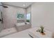 Spa-like bathroom with concrete walls, a soaking tub and walk-in shower at 513 Hand Ave, Sarasota, FL 34232