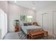 Serene bedroom with sliding glass doors, and a cozy sitting area at 513 Hand Ave, Sarasota, FL 34232
